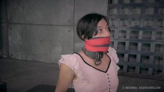 Petite Brunette in Metal Bondage